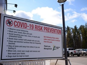 A sign details safety rules to prevent the spread of COVID-19 at Evergreen Park south of Grande Prairie on Saturday, Oct. 17, 2020. Municipal leaders from across the region have joined together to urge residents in their communities to co-operate in adhering to new COVID-19 restrictions in responding to rising case numbers in the province.