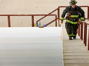 Devon Schwalm, a County of Grande Prairie Regional Fire Service firefighter, climbs the stairs of Gordon Badger Stadium as he participates in  Seventh Annual Firefighters Stair Challenge. Schwalm raised more than $500 for Wellspring Calgary. Wellspring Calgary provides supportive care to firefighters and citizens living with cancer. Participants have to initially raise a minimum of $250 to participate in the event.