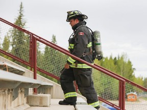 Devon Schwalm, a County of Grande Prairie Regional Fire Service firefighter, climbs the stairs of Gordon Badger Stadium as he participates in  Seventh Annual Firefighters Stair Challenge.