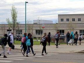Students walk to Ecole McTavish on Monday, May 31, 2021. Laura Beamish/Fort McMurray Today/Postmedia Network