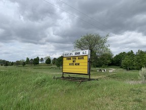 Sign outside Fescue's Edge Golf Course on the first day of golf following the COVID-19 lockdown in the spring of 2021