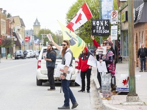 Fifteen people protest COVID-19 lockdown restrictions outside of the post office in Glencoe on Friday, May 7, 2021. Derek Ruttan/The London Free Press