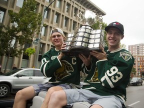 Christian Dvorak and Mitch Marner hoist the Memorial Cup as they are carried down Queens Avenue towards Budweiser Gardens as part of the Knights parade in London, 2016. (Mike Hensen/The London Free Press file photo)