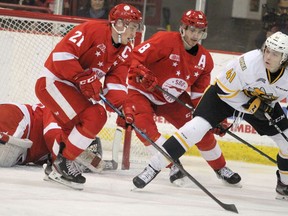 BRIAN KELLY/Sault Star
Soo Greyhounds Ryan O'Rourke (left) and Jacob LeGuerrier defend against the Sarnia Sting's Sam Bitten in 2020 Ontario Hockey League action at GFL Memorial Gardens.