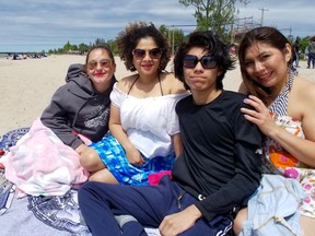 Sauble Beach was lightly populated with visitors Sunday, May 23, 2021. Among them were, from the left, Oxana Broukalo, of Vineland, Keyra Villeda, Steven Bran and his mother, Nurra Bran, all of Toronto.