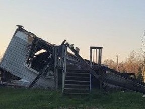 The remains of a home destroyed by fire at Saugeen First Nation on Saturday.