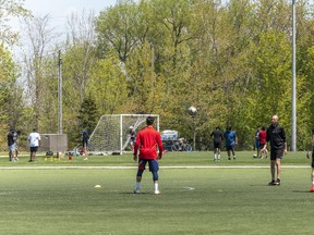 People play soccer at Cherry Beach in Toronto. Outdoor team sports remain banned everywhere in Ontario until at least June 14, while unorganized, unsafe, unmonitored sports can be played on any outdoor field or court, anywhere in the province.