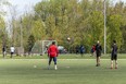 People play soccer at Cherry Beach in Toronto. Outdoor team sports remain banned everywhere in Ontario until at least June 14, while unorganized, unsafe, unmonitored sports can be played on any outdoor field or court, anywhere in the province.