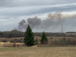 A wildfire burns in Parkland County near the village of Tomahawk on May 7, 2021.