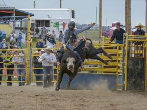 Airdrie's Fabian Dueck gave it his best shot on Baldy in the Bull Riding Bonanza on Monday, July 1, 2019, but unfortunately received no score. The 2021 Airdrie Pro Rodeo was cancelled. Photo by Kelsey Yates