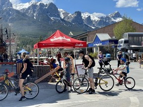 Residents and vistors from out of town enjoy the outdoors in downtown Canmore on May 16. The main street was opened up to pedestrians and as a cyclist-only space on May 5. There will be new temporary washrooms open located behind Miners' Hall. Photo Marie Conboy/ Postmedia.
