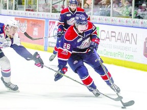 Photo courtesy Saginaw Spirit

Spirit centre Cam Baber (right), a Sault native, cuts to the net in OHL action against the Windsor Spitfires