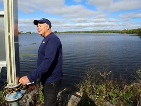 Mark Boone, a hydrogeologist with Quinte Conservation, checks a rain gauge Sept. 11, 2020 at Deerock Lake Conservation Area north of Flinton. The conservation authority's new drought management plan urges more water conservation and advance planning to ease the effects of drought.