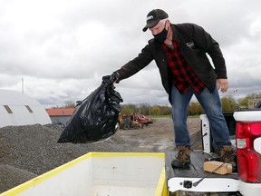 Tyendinaga Township resident Pat Walsh unloads trash Saturday morning at the municipal yard on Weese Road in Melrose. Residents of Tyendinaga, Belleville, Prince Edward County and Quinte West gathered litter from May 1 to May 8 during the annual Quinte Trash Bash campaign to remove waste from roadways and public spaces. Organizers said this year's results will be released early in the week.