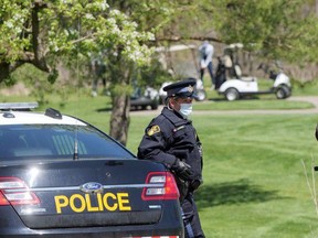 OPP monitor The Bridges at Tillsonburg, a golf course that opened in defiance of the provincial stay-at-home order. (Chris Abbott, Postmedia Network)
