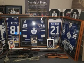 Provincial police said they recovered sports memorabilia and firearms in a search of a storage facility in Brant County.