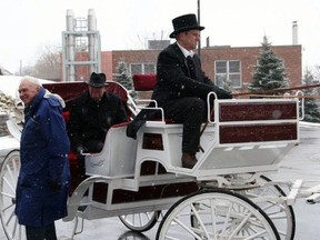 Dr. Jim Digby arrives at Brantford General Hospital's 125th anniversary celebration by horse-drawn carriage. Seated is then Brantford mayor Mike Hancock.