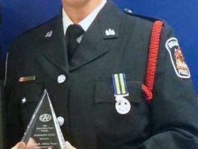 Const. Andrea Cooper is shown in 2016 with the CAA School Safety Patrol Program Achievement Award.