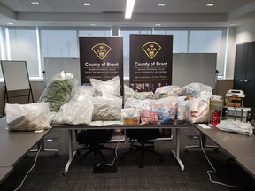 About $100,000 in cannabis products and processing equipment were seized, and two Brantford residents charged as the OPP-led Provincial Joint Forces Cannabis Enforcement Team and Street Crimes Units executed search warrants at two homes in Brantford and Brant County on Friday May 28, 2021. OPP PHOTO