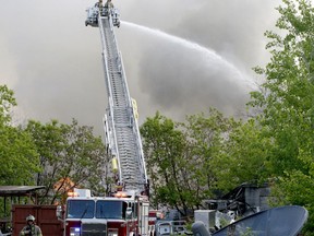 Thick black smoke billows from a fire at a storage structure at Harold's Demolition on Wednesday morning. (RONALD ZAJAC/The Recorder and Times)