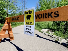 A sign at the entrance to the Brock Trail on Laurier Boulevard warns users of a bear spotted in the area. (RONALD ZAJAC/The Recorder and Times)