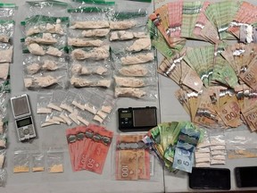 Provincial police released this image of drugs, cash and other items seized Thursday in Elgin and Kingston. (SUBMITTED PHOTO)
