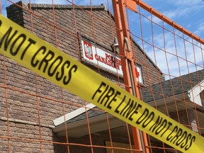 Caution tape hangs in front of the Polish Canadian Club on Inshes Avenue in Chatham. The club was gutted by a fire on May 19. Mark Malone/Postmedia Network