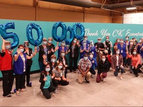 Chatham-Kent vaccination team members celebrate after administering their 50,000th dose of COVID-19 vaccine in Chatham, Ont., in May 2021. (Chatham-Kent Public Health Photo)