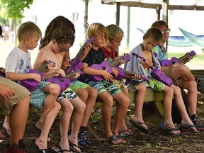 Children play ukuleles at Kenesserie Camp near Ridgetown in 2019. The camp has decided to cancel its summer overnight program for children this year.