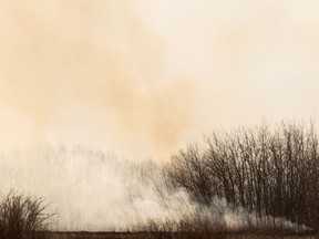 A grass fire on a homestead near Lamont, north of Edmonton, on Friday, April 16, 2021.