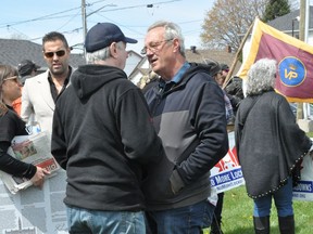 Lanark–Frontenac–Kingston independent MPP Randy Hillier speaks to a man during a lockdown protest on May 1 in Cornwall.