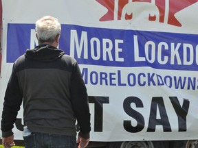 Lanark, Frontenac, Kingston Independent MPP Randy Hillier looked on as a truck pulling a large anti-lockdown sign made its way to the protest on Saturday May 1, 2021 in Cornwall, Ont. Francis Racine/Cornwall Standard-Freeholder/Postmedia Network