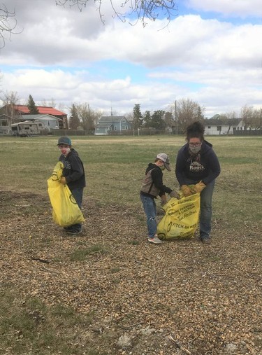 Shaina, Rexstin and Klyde Griffith do some garbage cleanup for Hanna Rangeland 4-H Multi Club. Hanna Rangeland photo