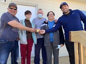 From left to right: Cold Lake First Nation Chief Roger Marten, Abbigale Coker, David Coker, Sara Piche and Trevor Benoit from Value Master Builders on Apr. 16, 2021.