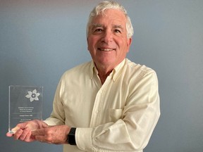 Dr. Joseph Pater with his Canadian Cancer Society Award for Excellence in Cancer Research: Lifetime Contribution Prize.