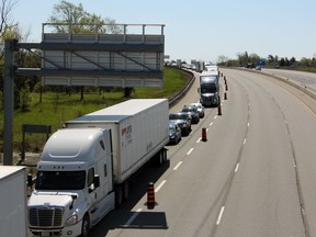 Traffic was backed up in the westbound lanes of Highway 401 in Kingston on Friday. Two collisions closed the highway, and one person was seriously injured.
