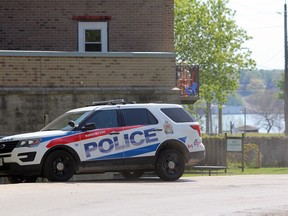 Kingston Police at 37 Cassidy St. in Kingston on Tuesday. An apartment in the building was the scene of a stabbing on May 13. The accused in that case was also charged with a murder the day before.