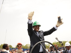 Chad's President Idriss Deby gives a thumb up as he holds a glass filled with oil on June 9, 2013 in Badila, southern Chad, during the opening of an oil valve operated by Canadian oil explorer Caracal Energy.  AFP PHOTO BRAHIM ADJIBRAHIM ADJI/AFP/Getty Images