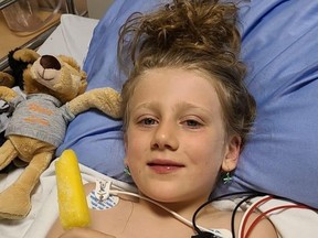 Seven-year-old Emilia Fontana was all smiles in hospital in Sudbury where she was airlifted after being rescued from the Blanche River near her home in Swastika on Sunday.