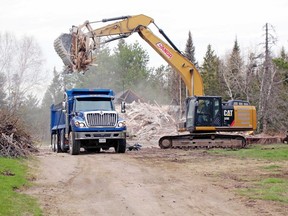 Work crews demolish the old Dionne Quintuplets' Nursery next to Nipissing Manor, Monday.
PJ Wilson/The Nugget