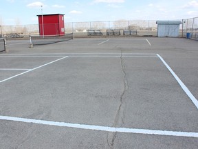 This large crack in the tennis court located near LP Miller School is causing safety concerns. Photo Susan McNeil.