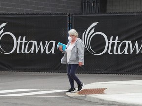 File: People leaving after receiving their COVID-19 vaccination at the Nepean Sportsplex in Ottawa.