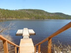 A photo taken in front of That Canadian Lodge (formerly Pointe aux Pins Lodge), from the road in Rapides-Des-Joachims looking down across the Ottawa River.