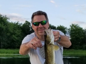 The author with a nice walleye caught, and released, from a lake in the Quebec Laurentians.