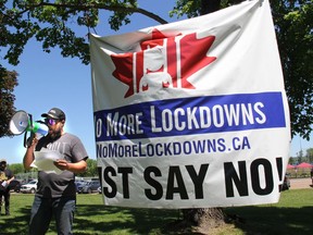 One of the organizers of the first Freedom Rally in Pembroke, held to protest government lockdowns, and to promote opening businesses back up, addresses the crowd at Riverside Park in Pembroke on May 29.The man identified himself as Gerry but did not want to give his last name.
