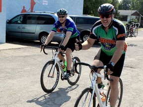 Damien McCarthy (right) gives a thumbs up as he and Troy Thibeau cross the finish line during the Tour de Bonnechere - Moving on Mental Health ride in 2017. Because of COVID, organizers are planning a virtual Tour de Bonnechere during August in which participants choose the date, time and place they want to ride, as opposed to the traditional in-person group event based out of the Legion field in Eganville.