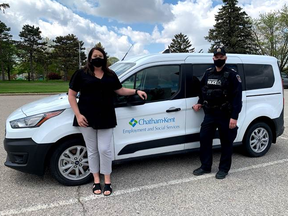 Chatham-Kent emergency housing supervisor Tara Lauzon, left, and Chatham-Kent police Sgt. Doug Cowell show the van used by Chatham-Kent employment and social services to help the community’s homeless. (Chatham-Kent Police Service Photo)