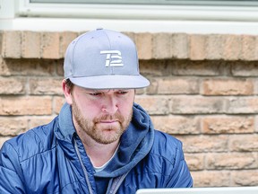 New Soo Thunderbirds general manager Jamie Henderson conducts business in his "outdoor office" in the back yard of his east end home. Henderson is working on player recruitment ahead of the 2021-2022 Northern Ontario Jr. Hockey League season. The NOJHL opens for new registry business on June 1. BOB DAVIES/SAULT THIS WEEK