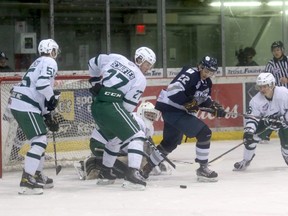 Members of the Sherwood Park Crusaders and the Grande Prairie Storm battle for a loose puck in front of the Crusaders net during the second period of last Saturday's Alberta Junior Hockey League game at Revolution Place. The Storm finish the regular season in Sherwood Park this coming weekend.