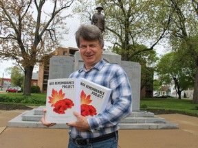Retired Sarnia teacher Tom Slater holds the two volume third edition of The Sarnia War Remembrance Project he recently completed, telling the stories of the Sarnia-area's war dead and the communities' experiences during wartime.